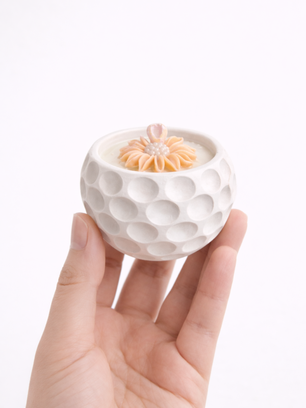 vela aromatica con recipiente artesanal